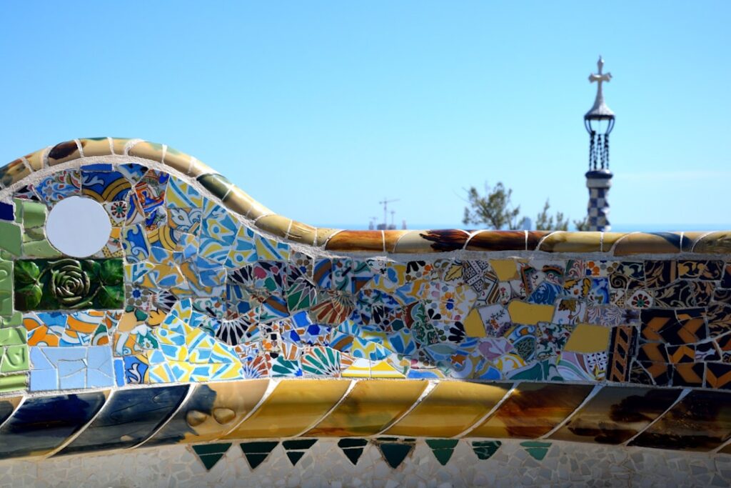 a close up of a colorfully painted bench