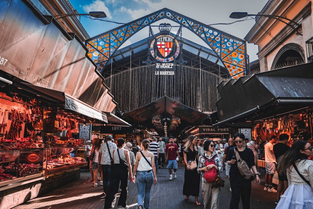 People shop at a vibrant market.